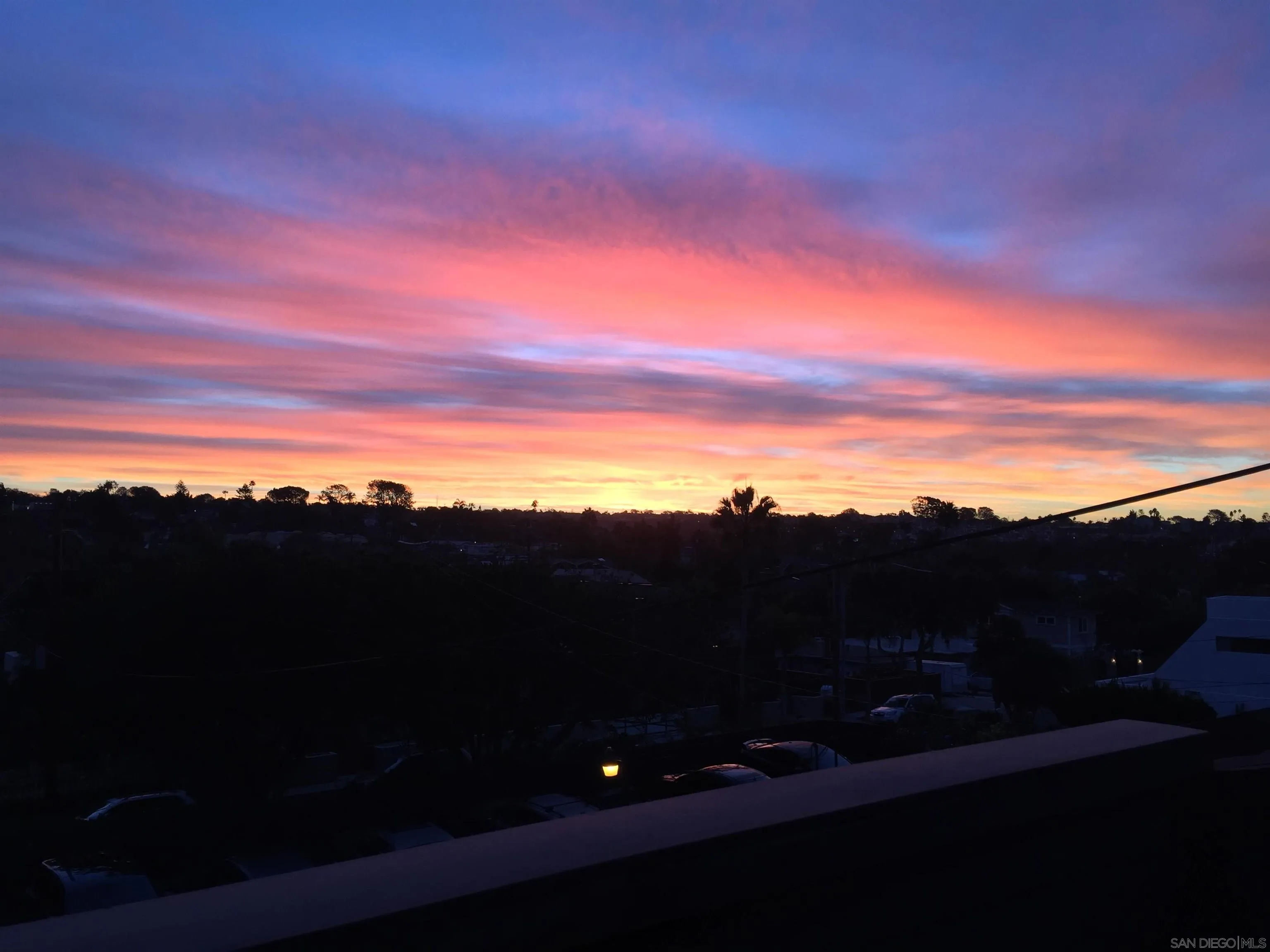 Sunrise view from the back balcony at 194 Neptune Ave-Encinitas-CA-92024 Leucadia Neighborhood-featuring vibrant skies, quiet, and tranquil coastal ambiance in this luxury home listed by FW Property Group