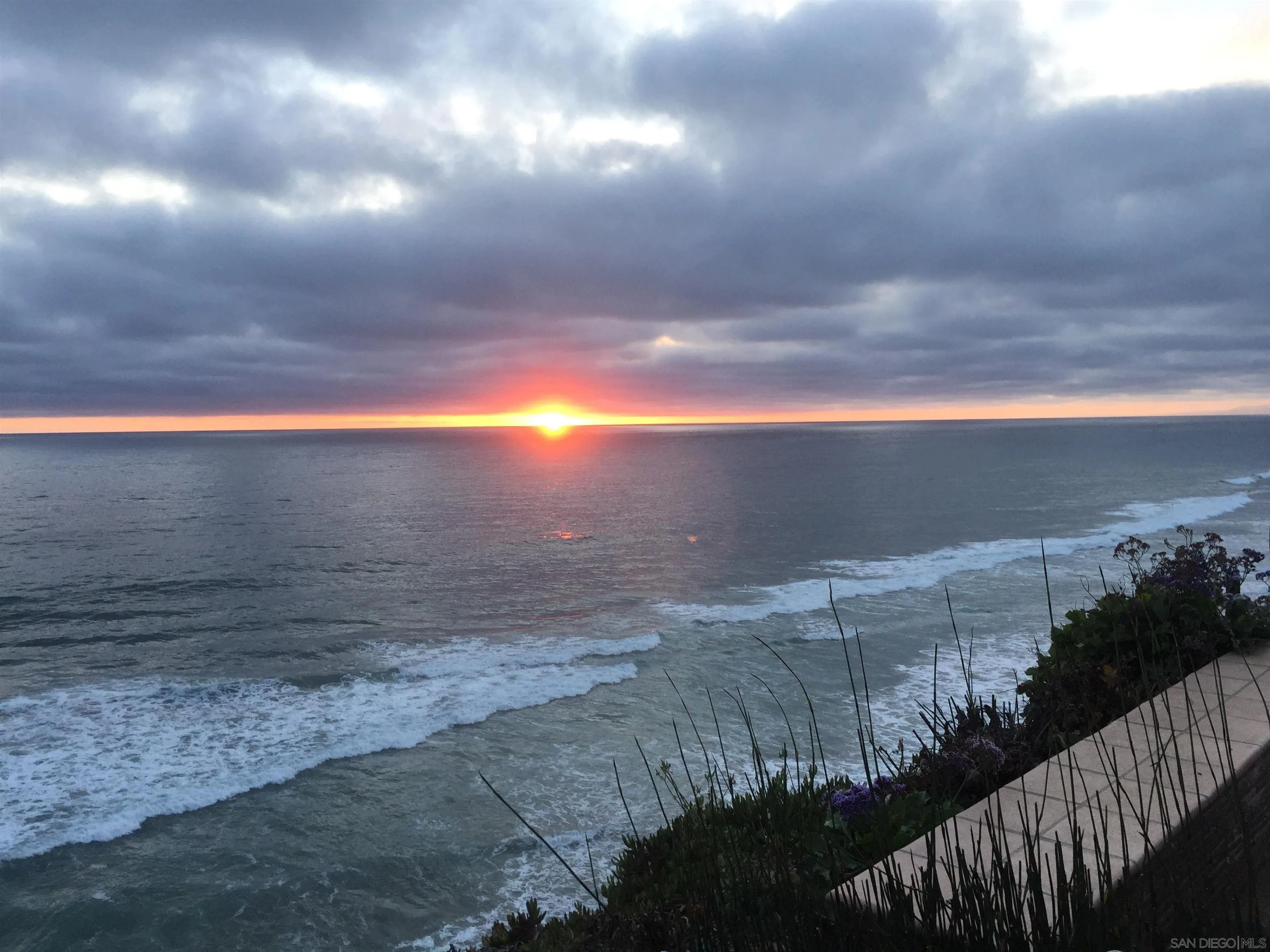 Oceanfront sunset view from 194 Neptune Ave-Encinitas-CA-92024-capturing golden skies, coastal horizon, and beachfront serenity at this luxury listing by FW Property Group