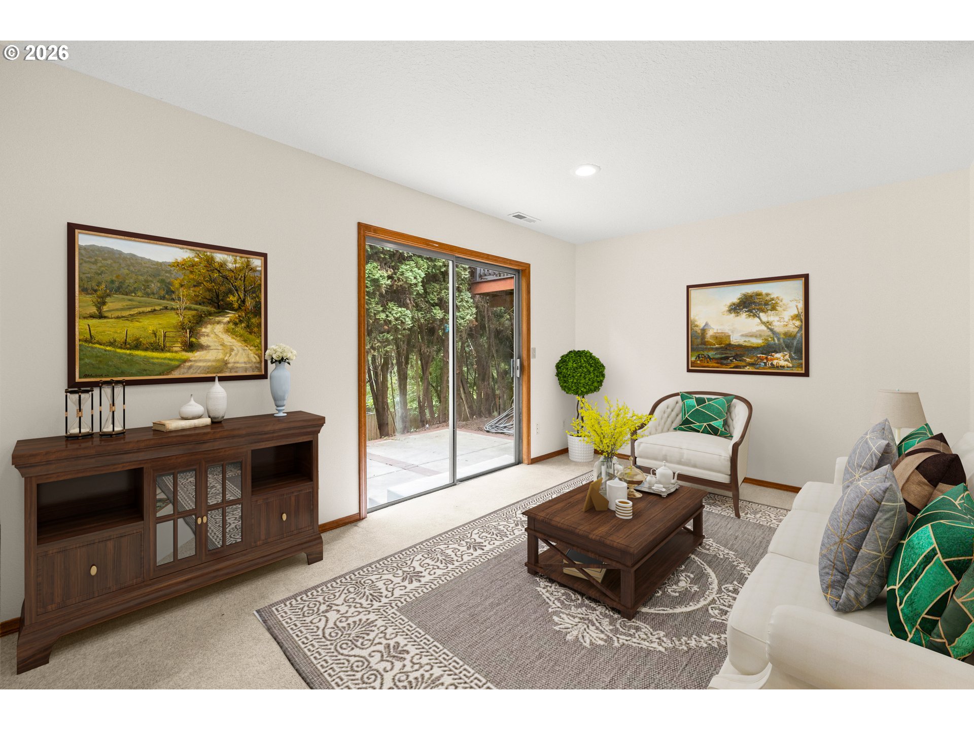 Furnished living room with a sliding glass door opening to a tree-lined patio.