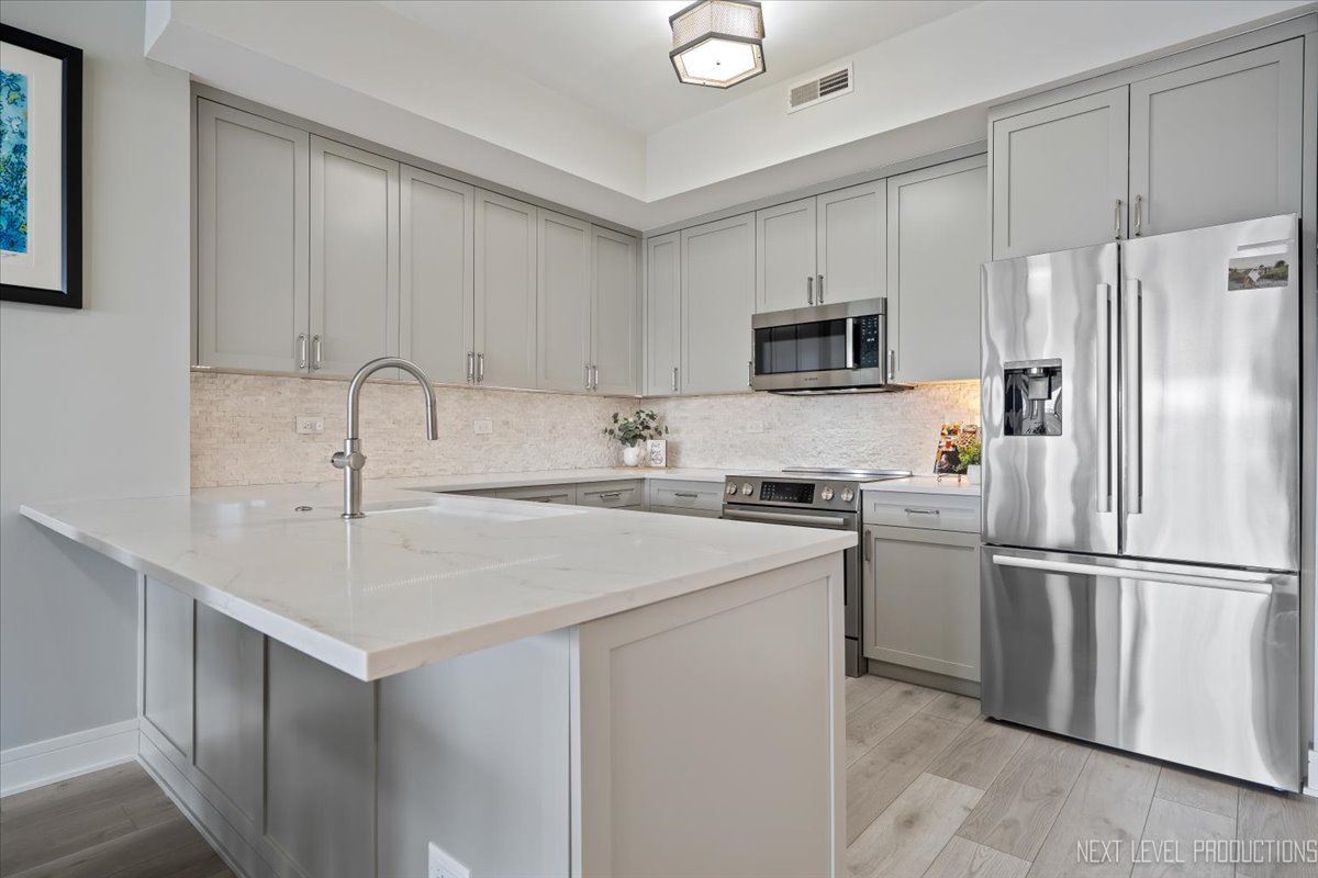 100 N River Lane Unit: 203