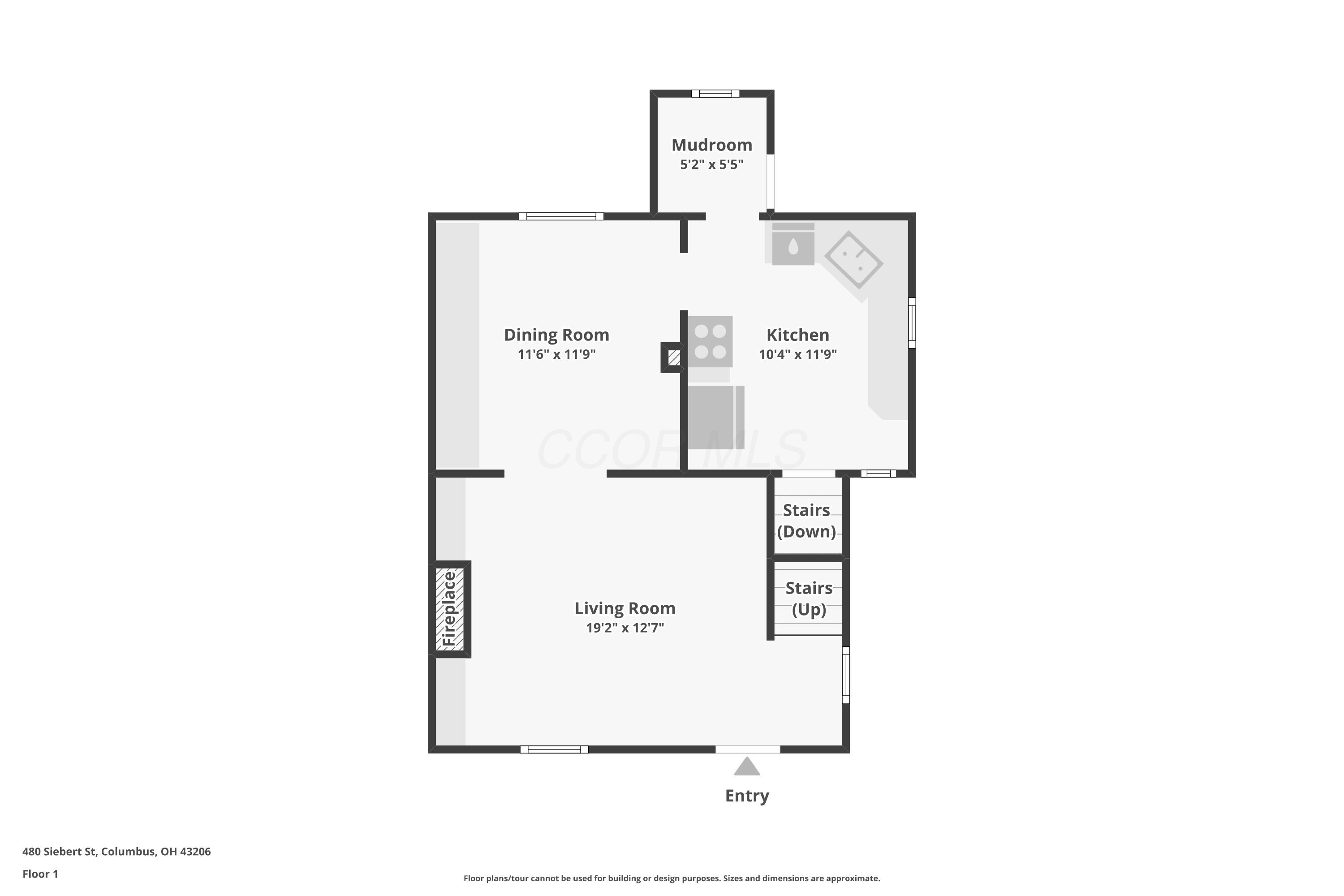 First-floor plan showing living room with fireplace, dining room, kitchen, mudroom, and stairs.