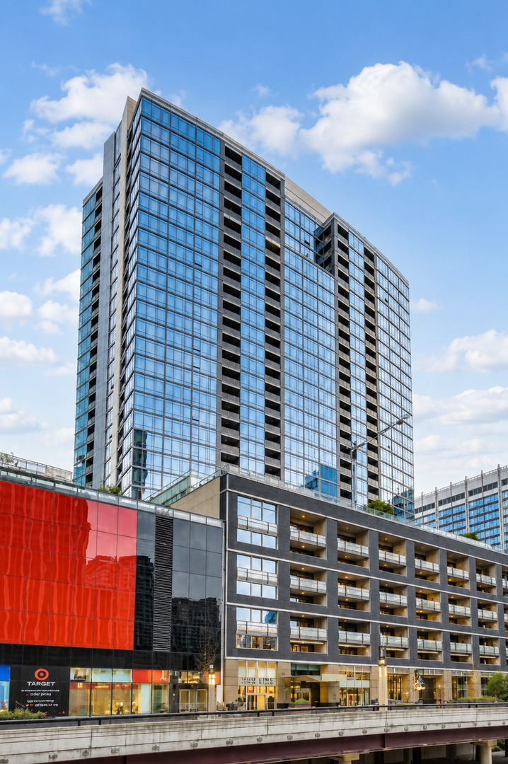 Modern glass high-rise condominium above a multi-level retail podium and Target storefront.