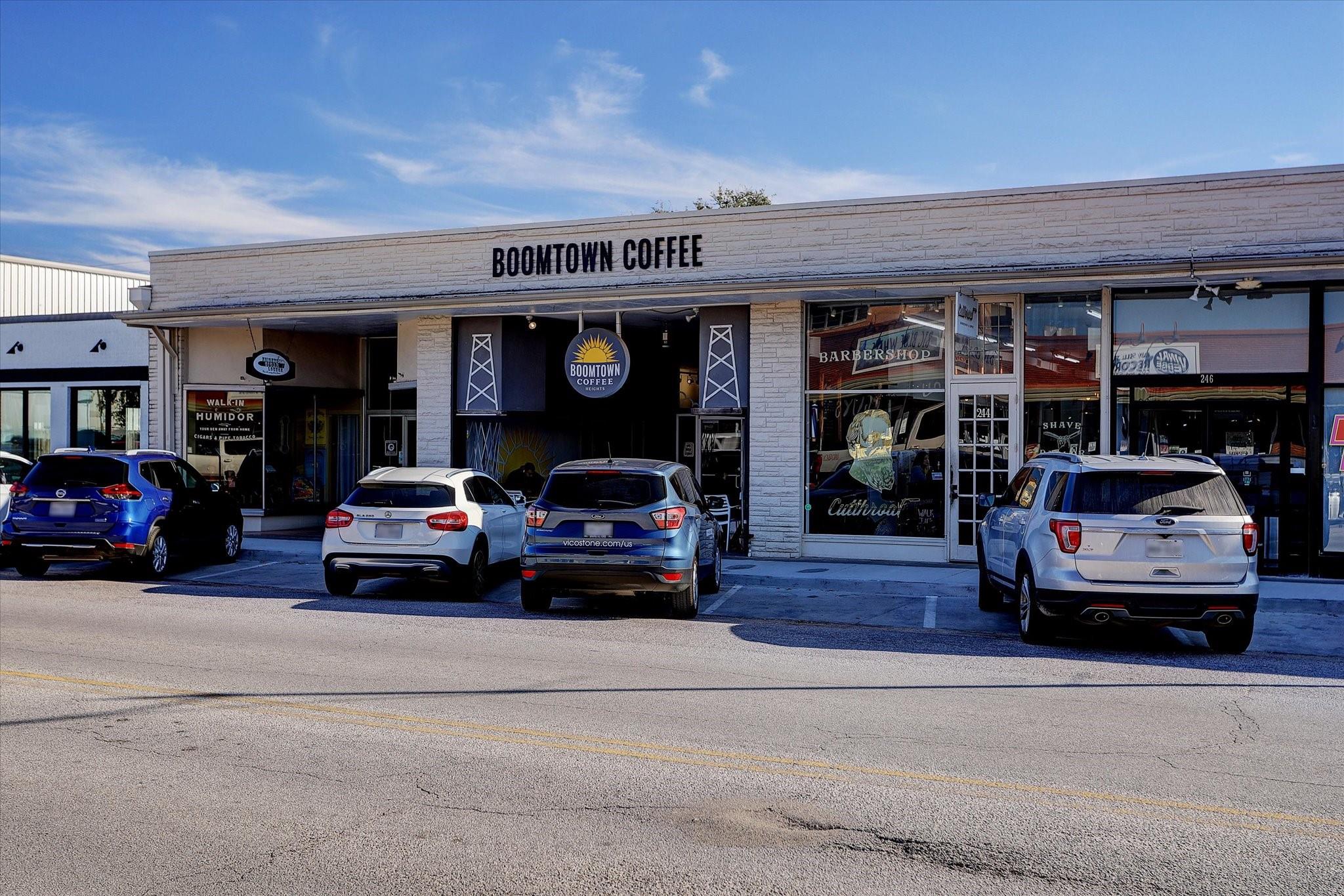Retail storefront with Boomtown Coffee and a neighboring barbershop.