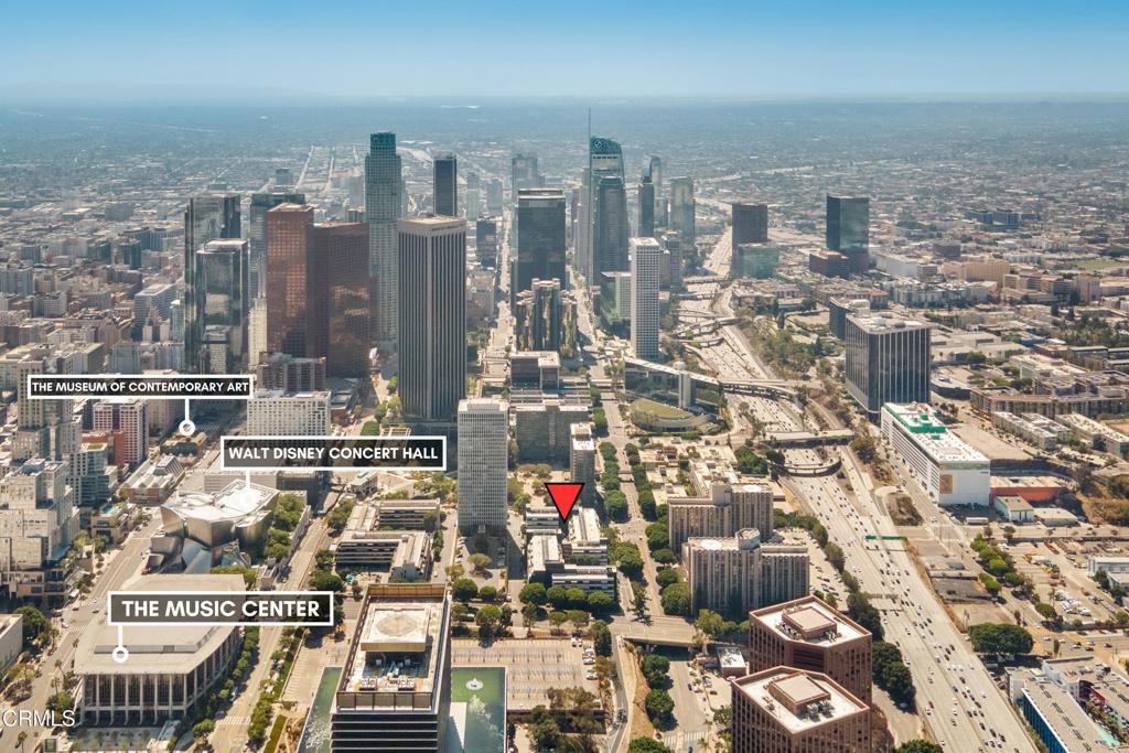 Aerial view of downtown Los Angeles with a red property marker and labeled cultural landmarks.