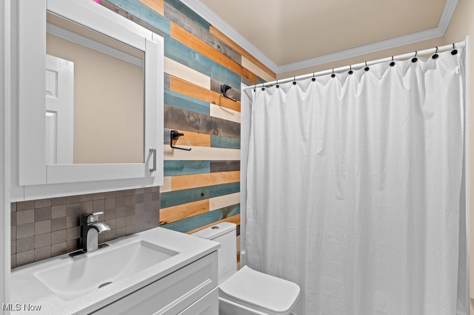 Bathroom with a white vanity and shower curtain beside a colorful horizontal wood-look accent wall.
