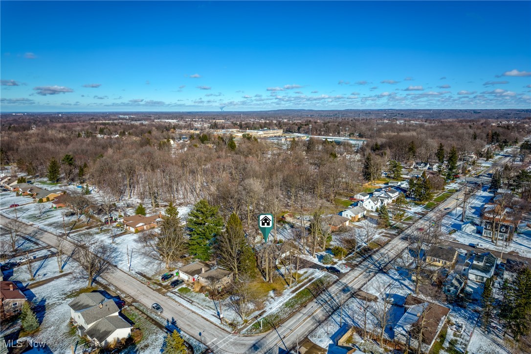 Aerial view of a snow-dusted Highland Heights neighborhood with the property marked near the center.