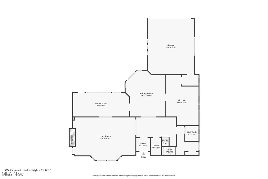 First-floor plan showing living and media rooms, kitchen, dining room, garage, and fireplace.
