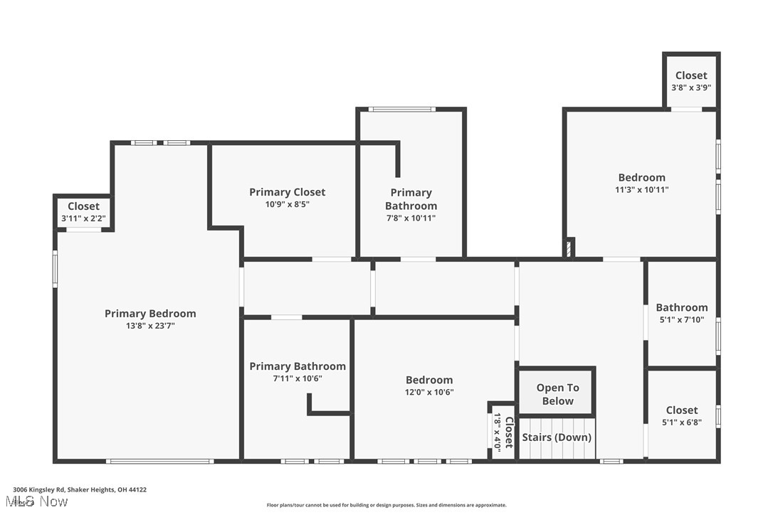 Floor plan showing a primary suite, two bedrooms, bathrooms, closets, stairs, and an open-to-below area.