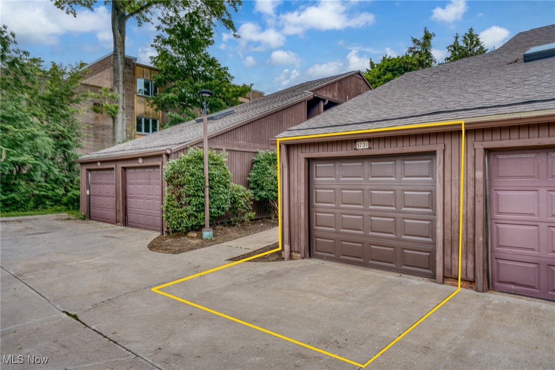 Garage 3721 with marked driveway space in a row of garages.
