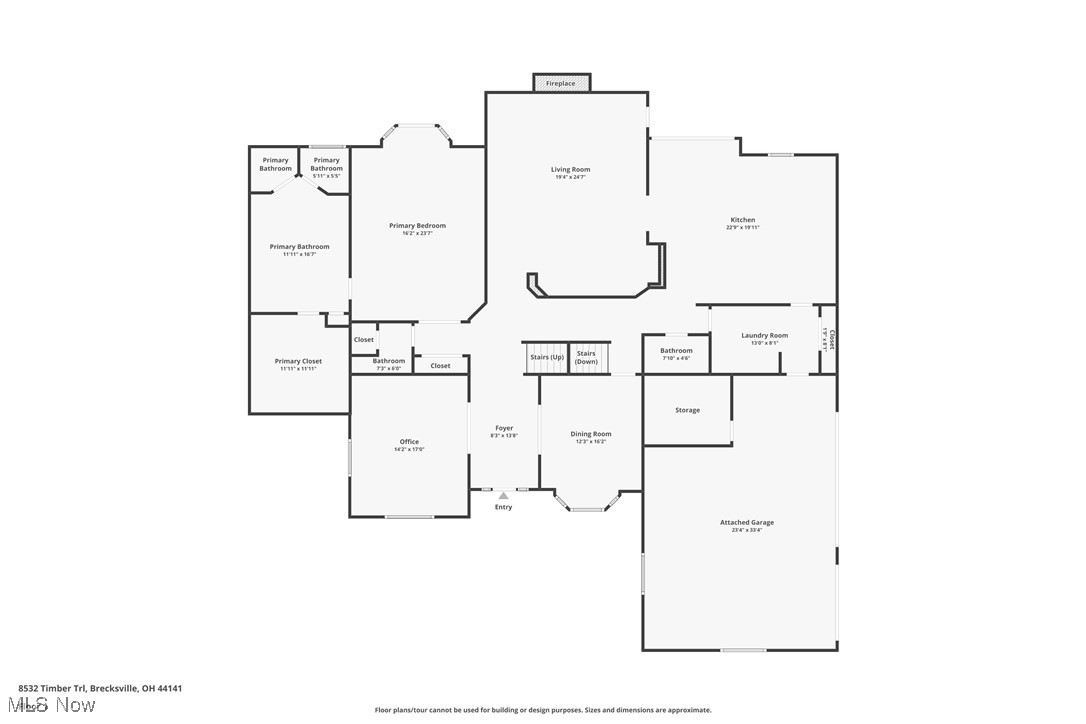 First-floor plan showing a primary suite, open living and kitchen areas, office, dining room, and attached garage.