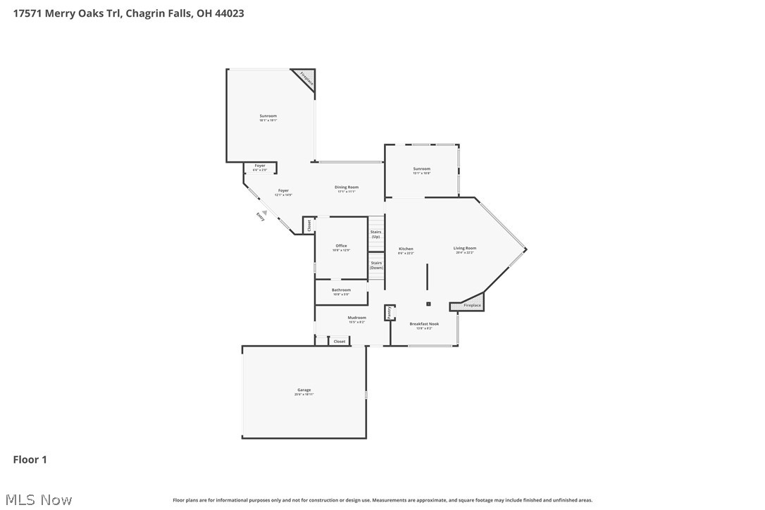 First-floor plan with two sunrooms, a garage, and labeled living spaces.