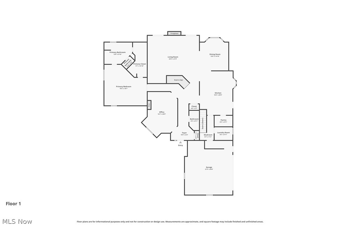 First-floor plan showing a primary suite, living and dining rooms, kitchen, office, and attached garage.