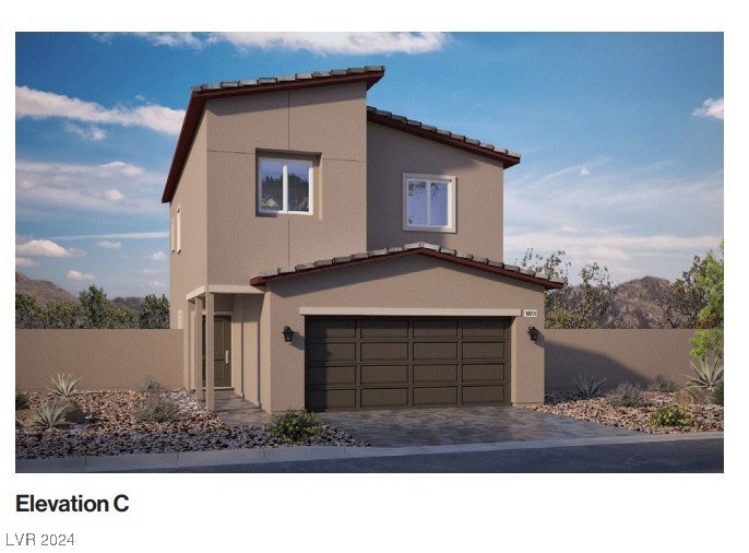 Two-story beige home with a double garage, desert landscaping, and mountain scenery.