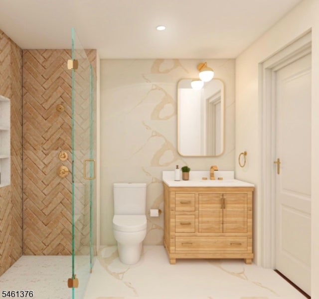 Bathroom with a glass shower, tan herringbone tile, and a light wood vanity.