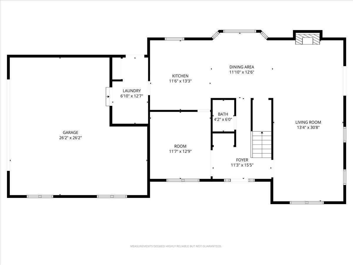 Floor plan showing the home's garage, kitchen, dining area, living room, foyer, laundry, bathroom, and room.