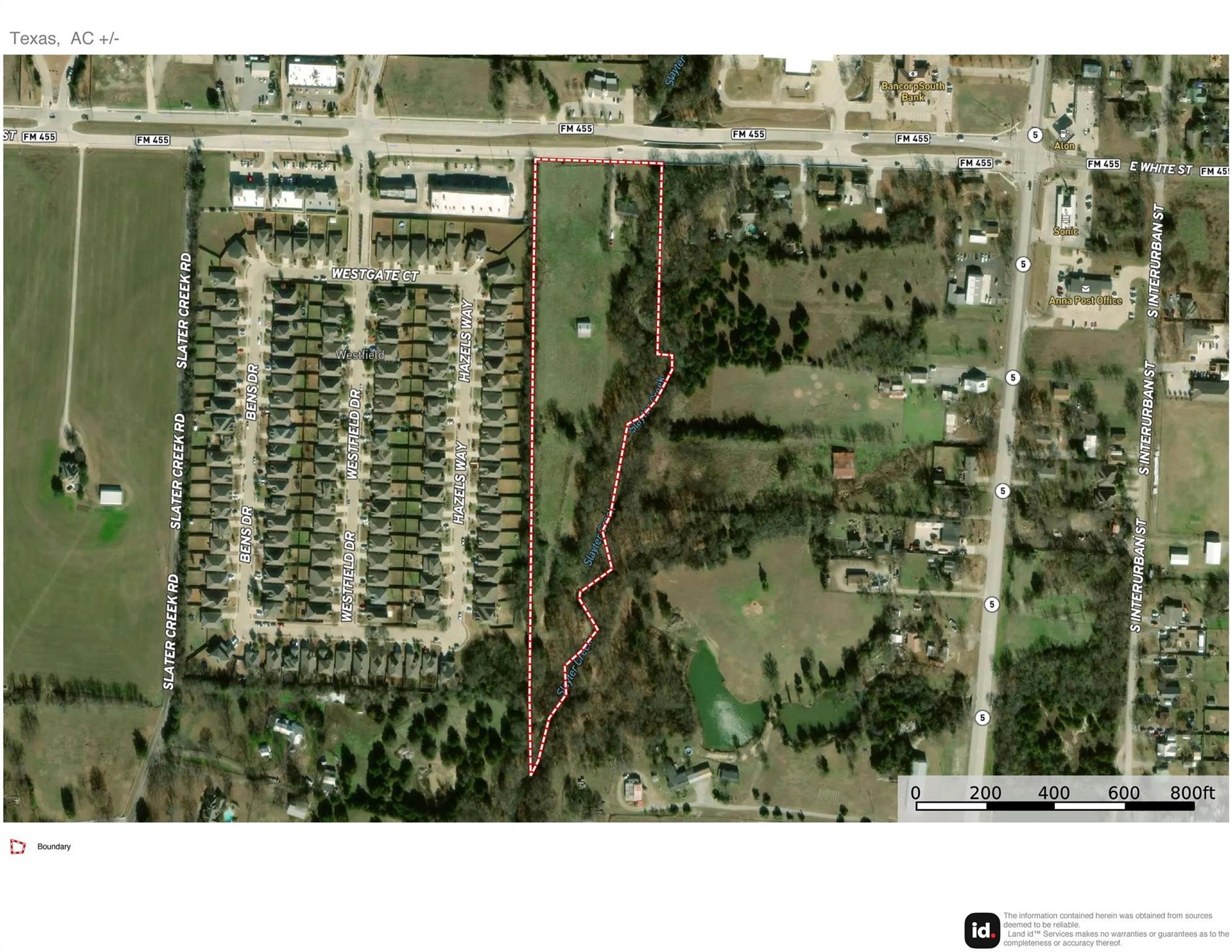 Aerial map of the red-outlined property along FM 455, beside a residential subdivision.