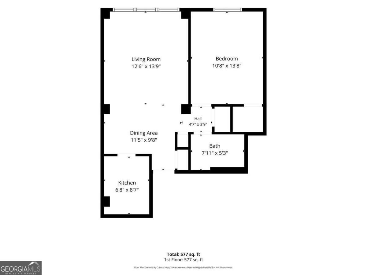 577-square-foot floor plan showing a bedroom, living room, dining area, kitchen, bathroom, and hall.
