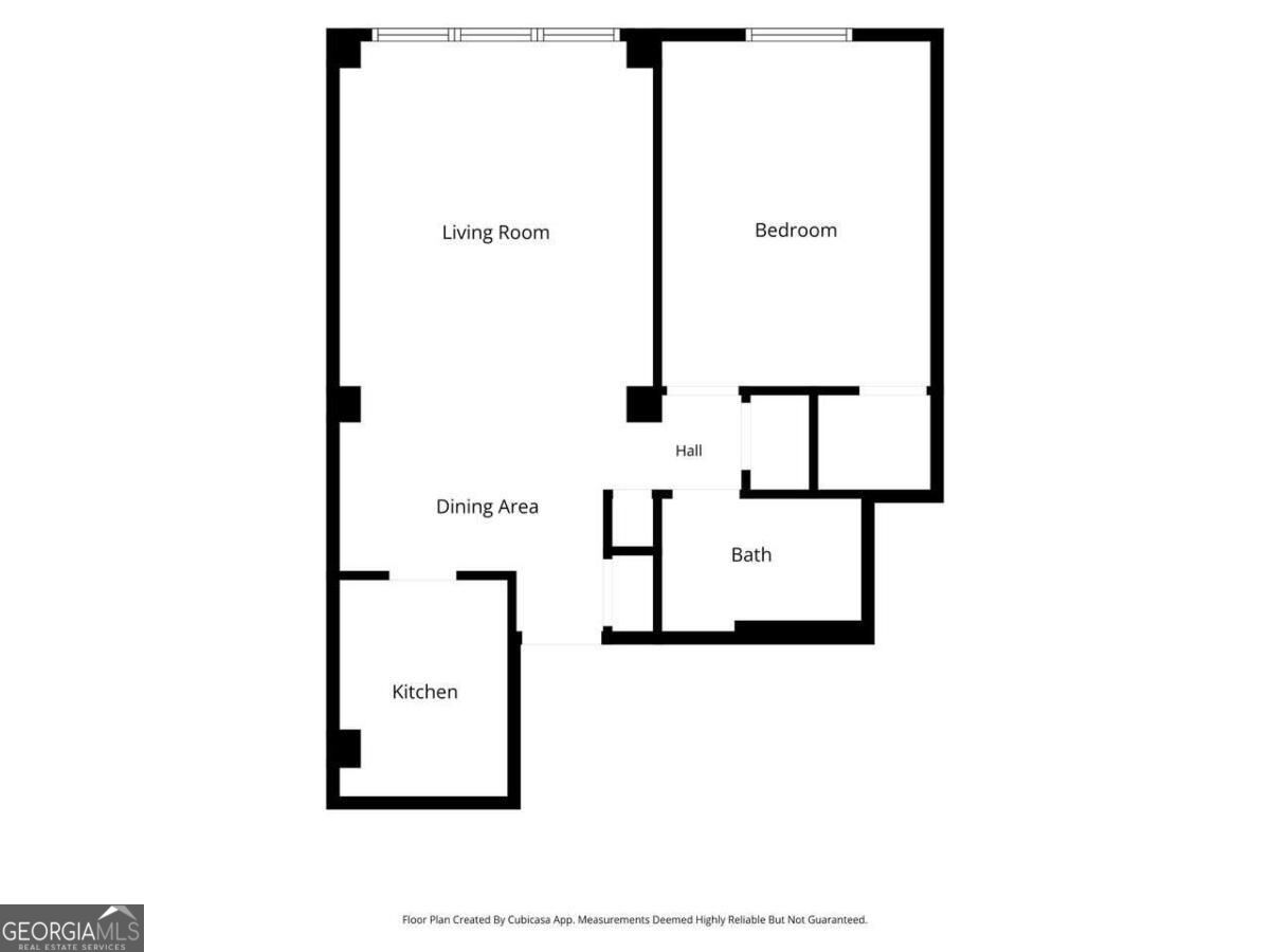 One-bedroom condo floor plan with a separate kitchen, dining area, living room, and bath.