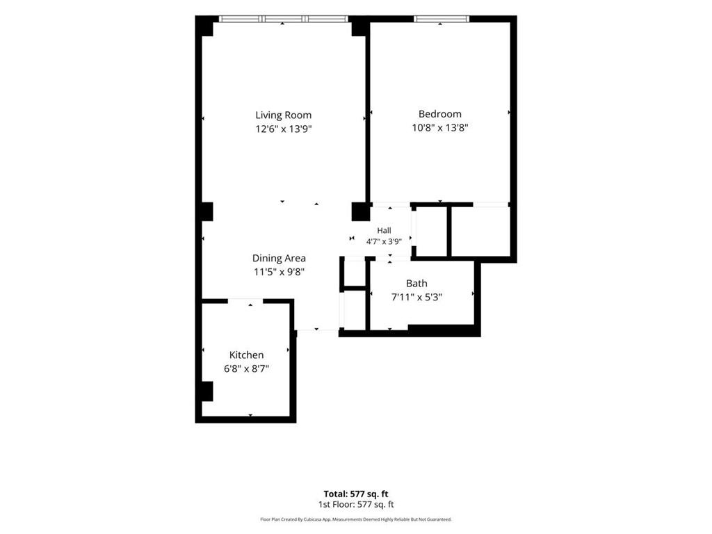 One-bedroom apartment floor plan showing a living room, dining area, kitchen, bath, and 577 square feet.