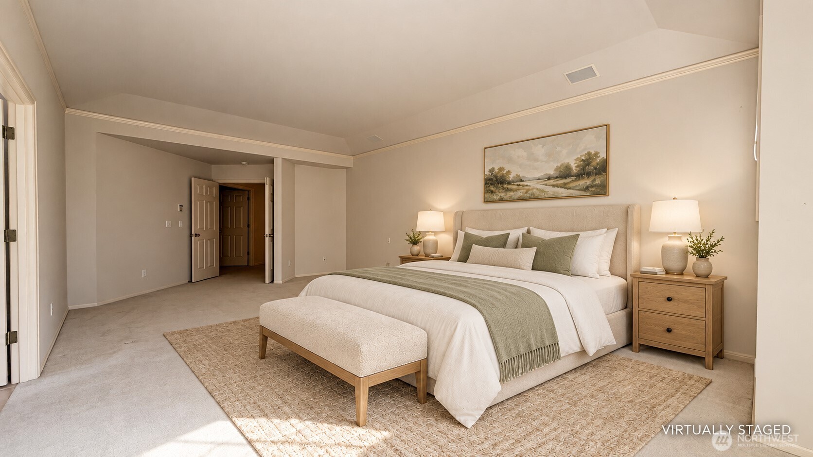 Virtually staged bedroom with a large bed, upholstered bench, and vaulted ceiling.