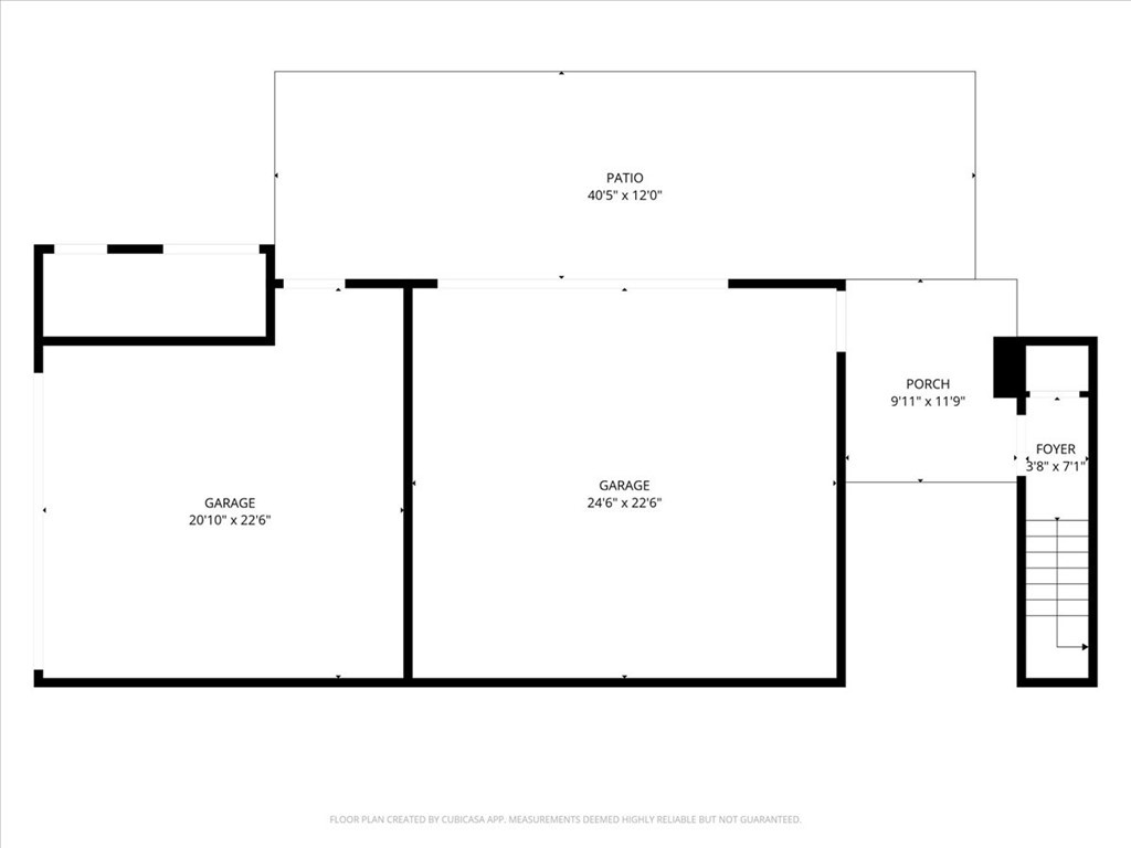 Floor plan showing two garages, a large patio, porch, foyer, and stairs.