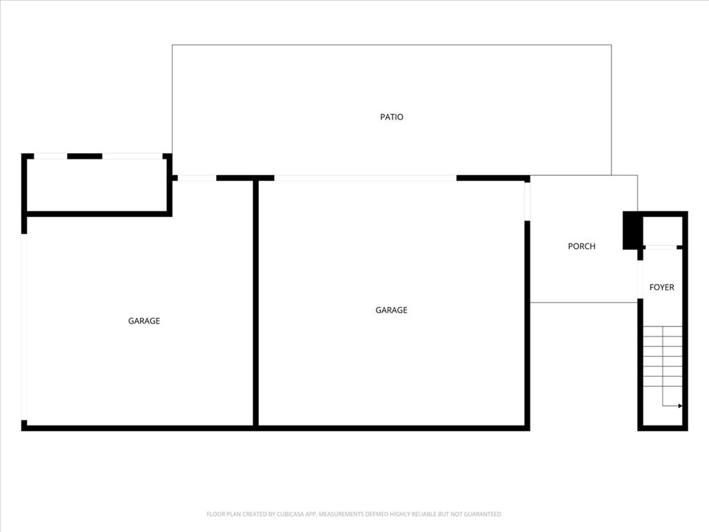 Floor plan with two garages, a patio, porch, foyer, and stairs.