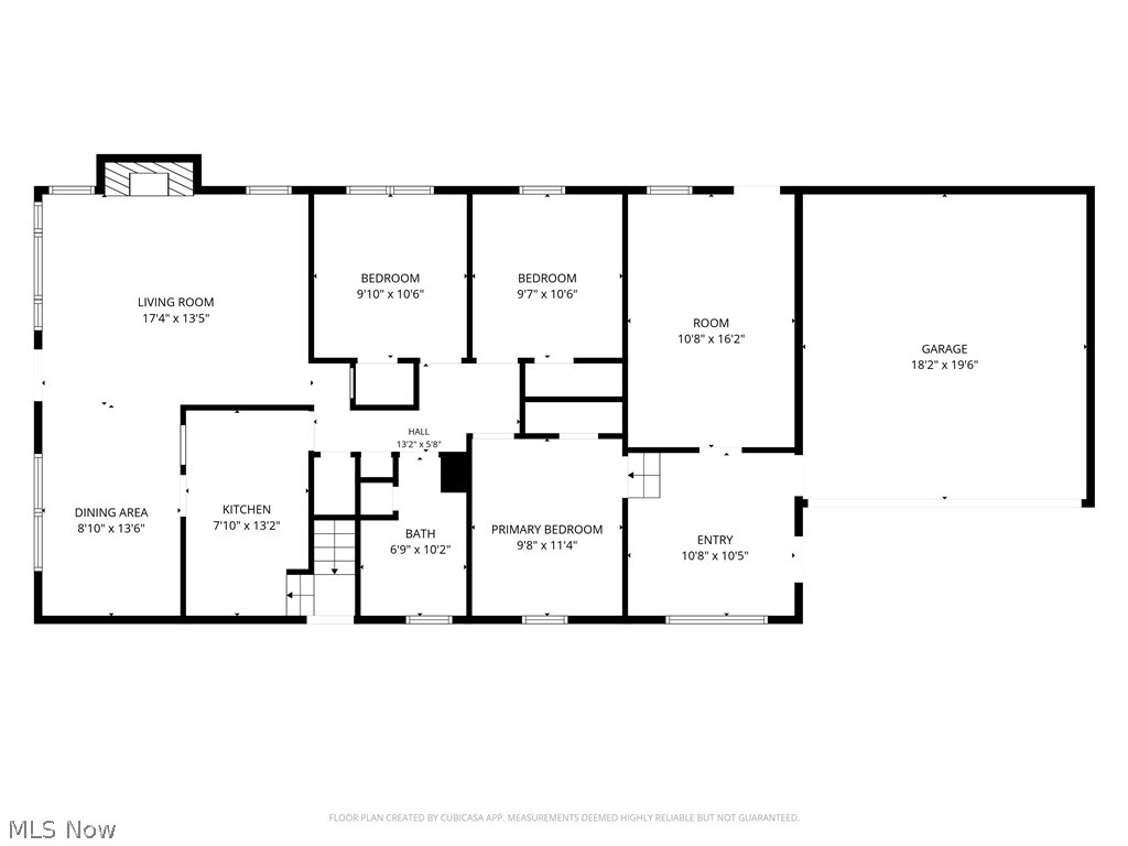 Floor plan showing three bedrooms, living and dining areas, kitchen, bath, entry, and attached garage.