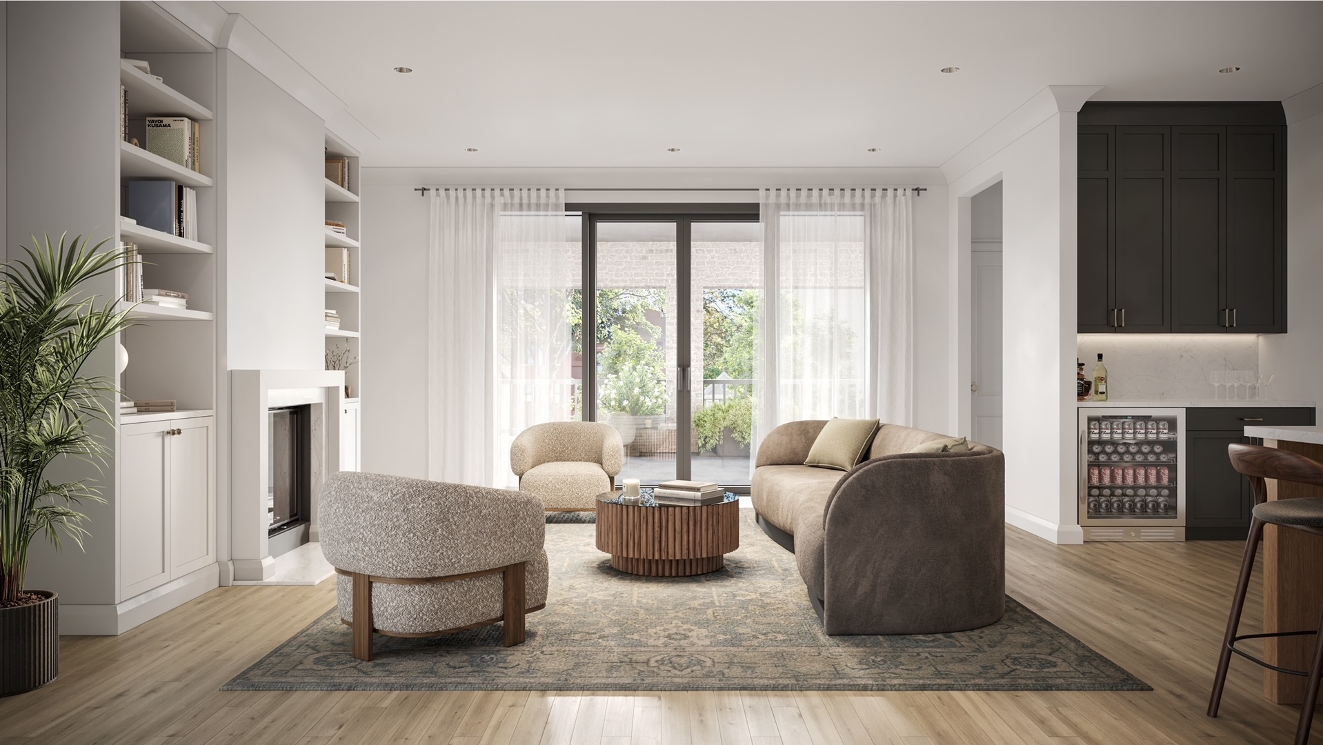 Furnished living room with a fireplace, built-in shelving, dark kitchen cabinets, and glass doors to a planted outdoor space.