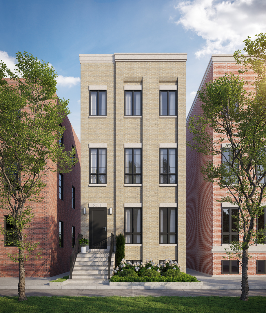 Tan-brick building at 851 W Wolfram Street with a raised entrance and landscaped front.
