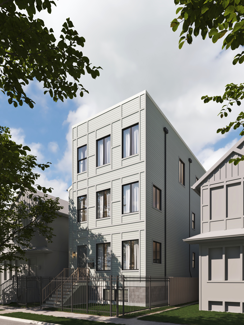 Contemporary three-story gray residence with tall windows, front steps, and a fenced yard.