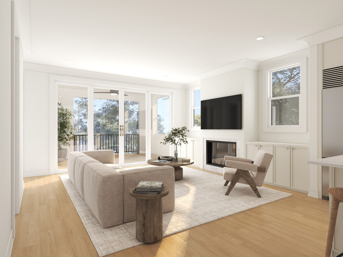 Bright staged living room with a fireplace, wall-mounted TV, and glass doors to a balcony.