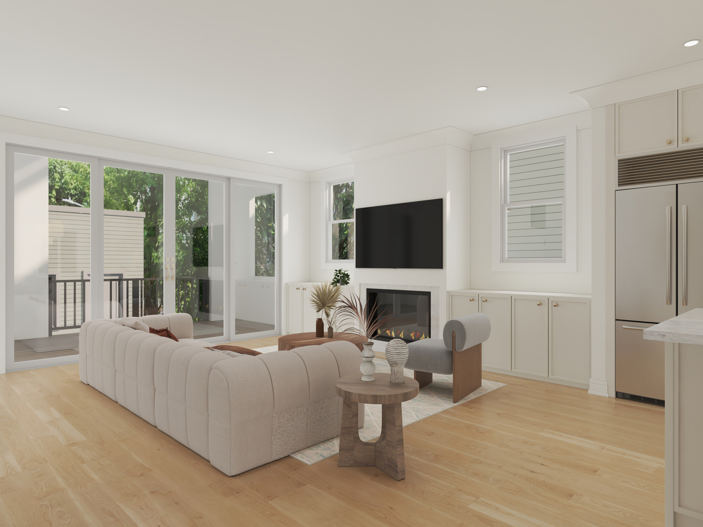 Bright living room with sectional sofa, fireplace, wall-mounted television, and sliding glass doors.