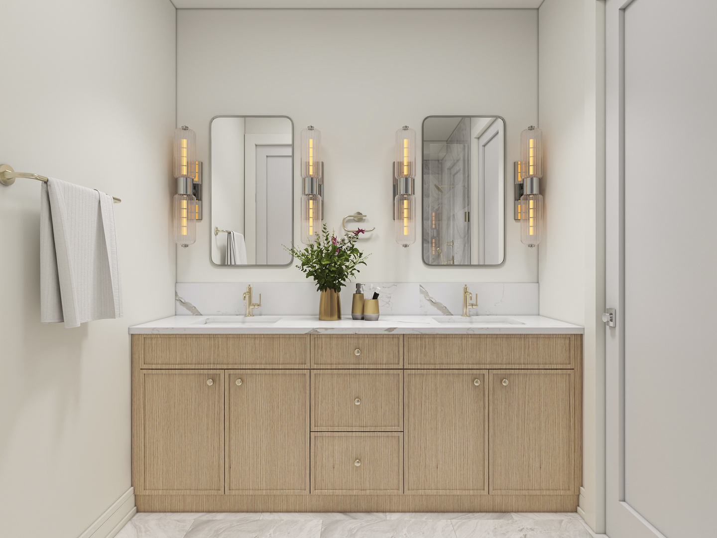 Bathroom double vanity with light-wood cabinetry, marble counters, paired mirrors, and warm sconces.