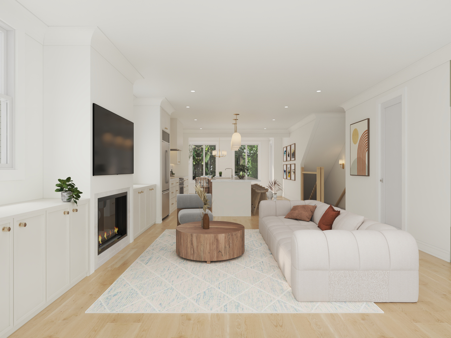Open-plan living room with a white sectional, gas fireplace, and kitchen island