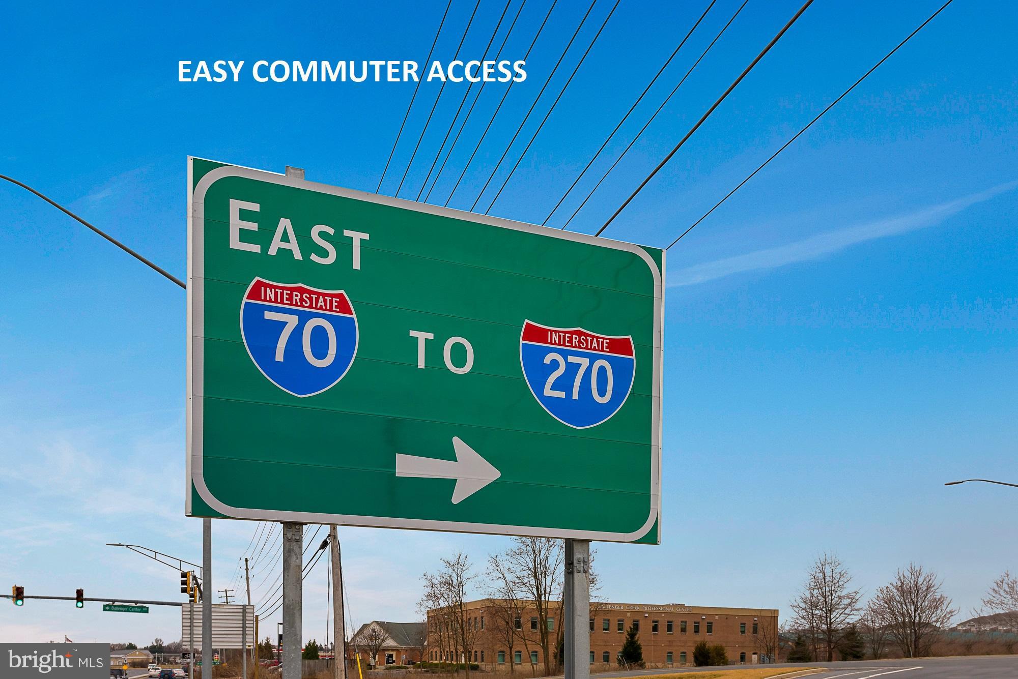 Highway sign showing eastbound access to Interstates 70 and 270, with a right-pointing arrow.