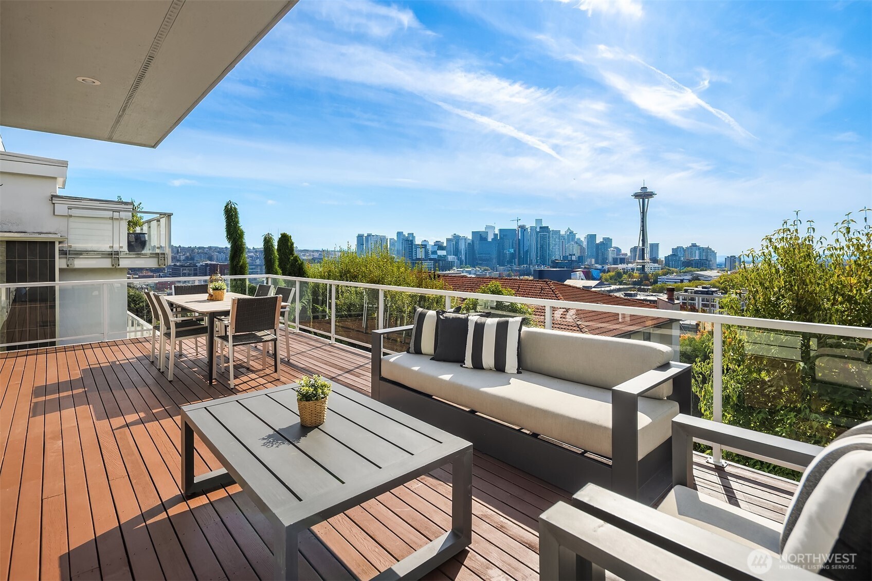 Furnished rooftop deck overlooking Seattle’s skyline and the Space Needle.