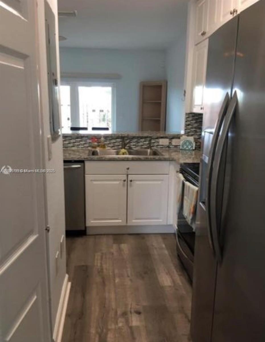 1690 NE 33rd Ave # 6 Unit: 104-6