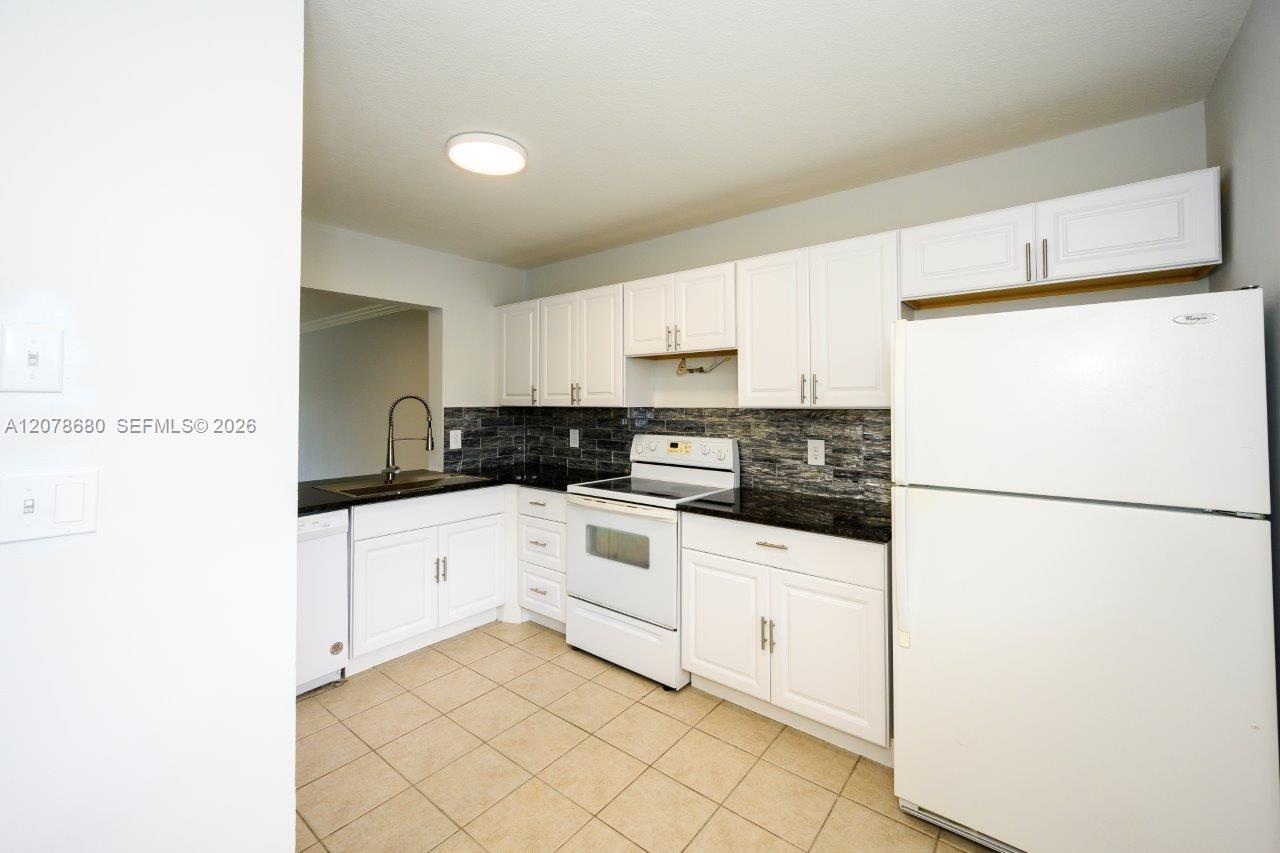 100 SE 7th St # 1