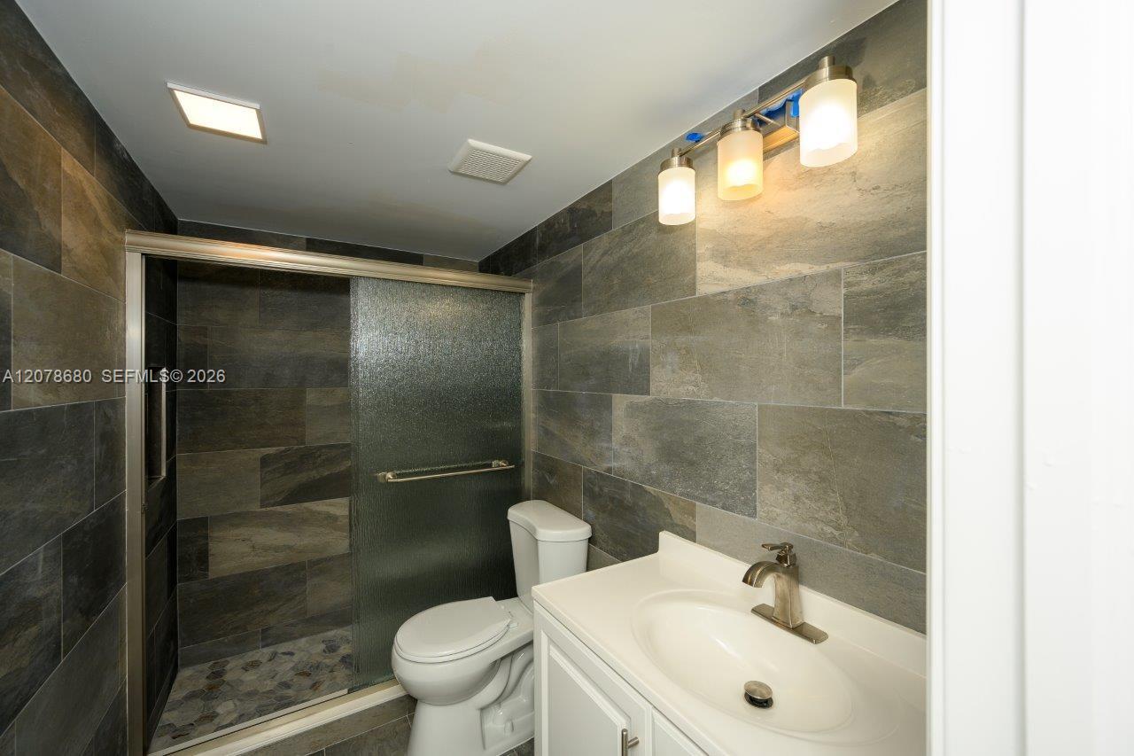 100 SE 7th St # 1