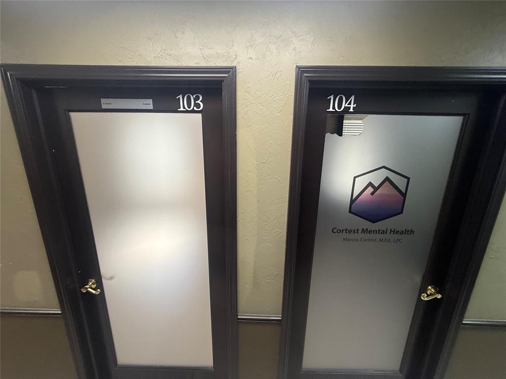 Office hallway with doors 103 and 104; door 104 displays Cortest Mental Health signage.