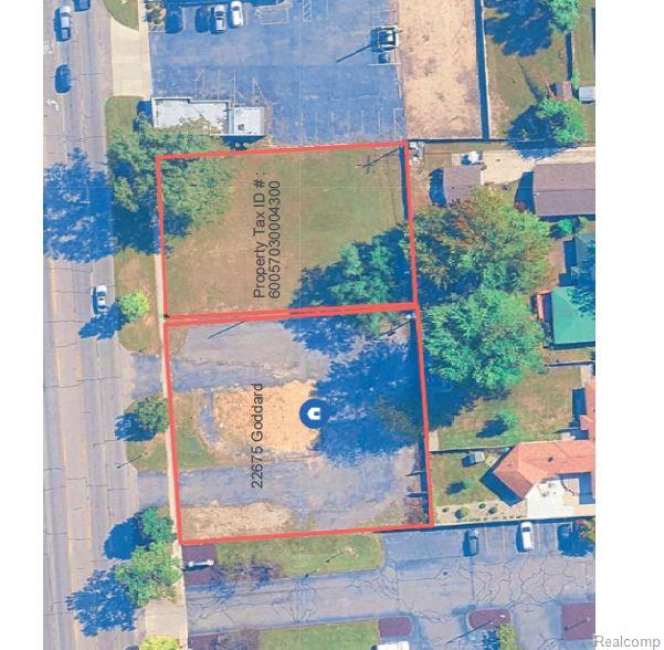 Aerial view of vacant lots outlined in red along Goddard Road, with the address and property tax ID labeled.