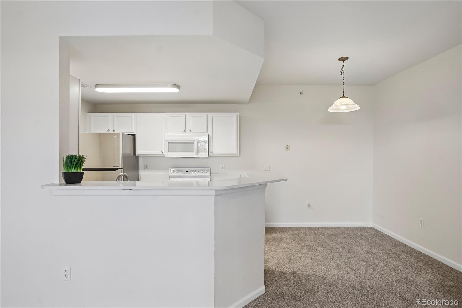 7440 S Blackhawk Street Unit: 11-203