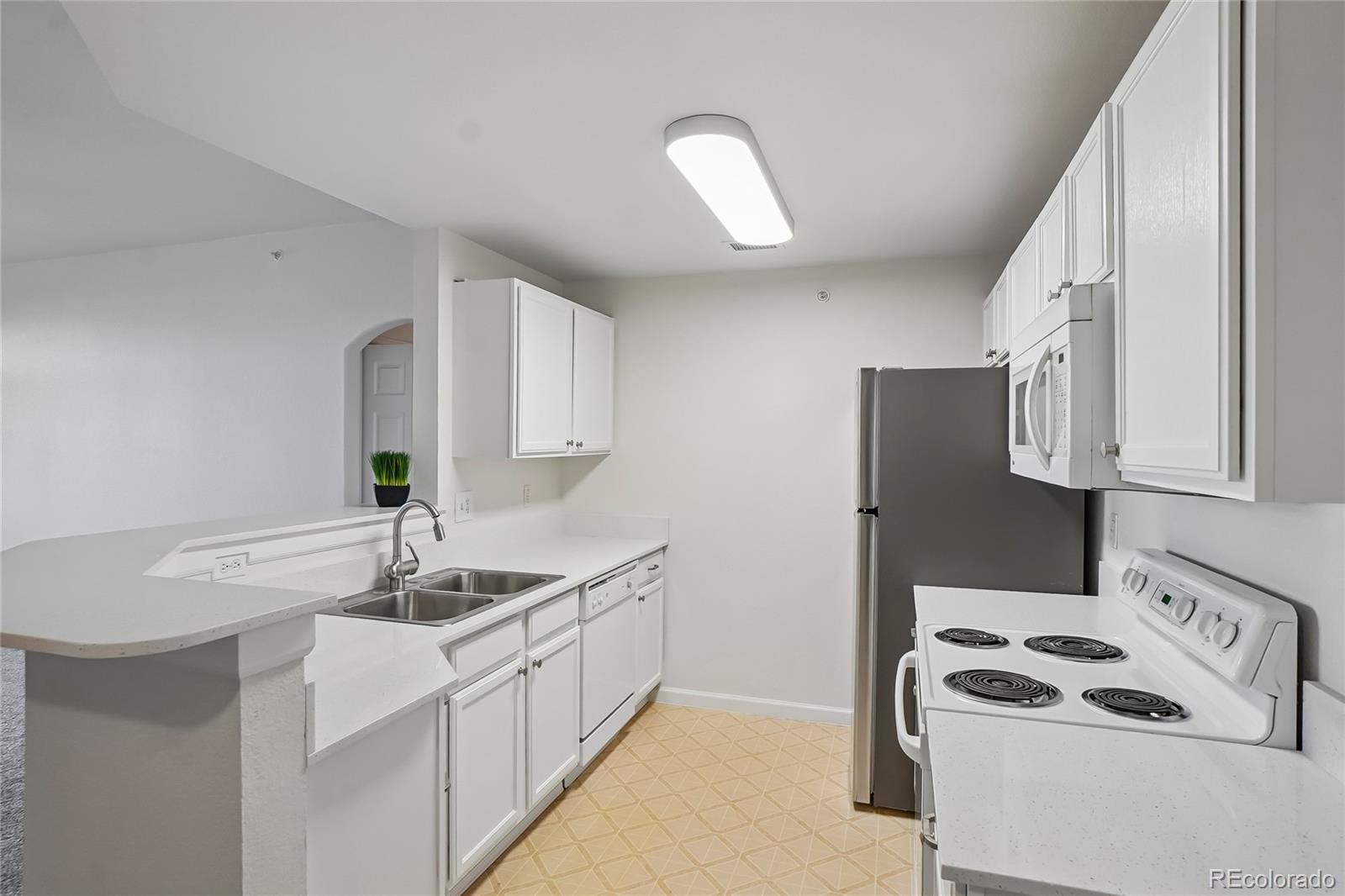 7440 S Blackhawk Street Unit: 11-203