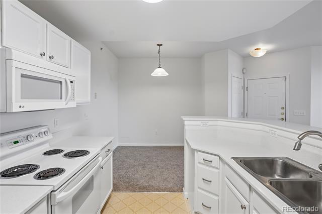 7440 S Blackhawk Street Unit: 11-203