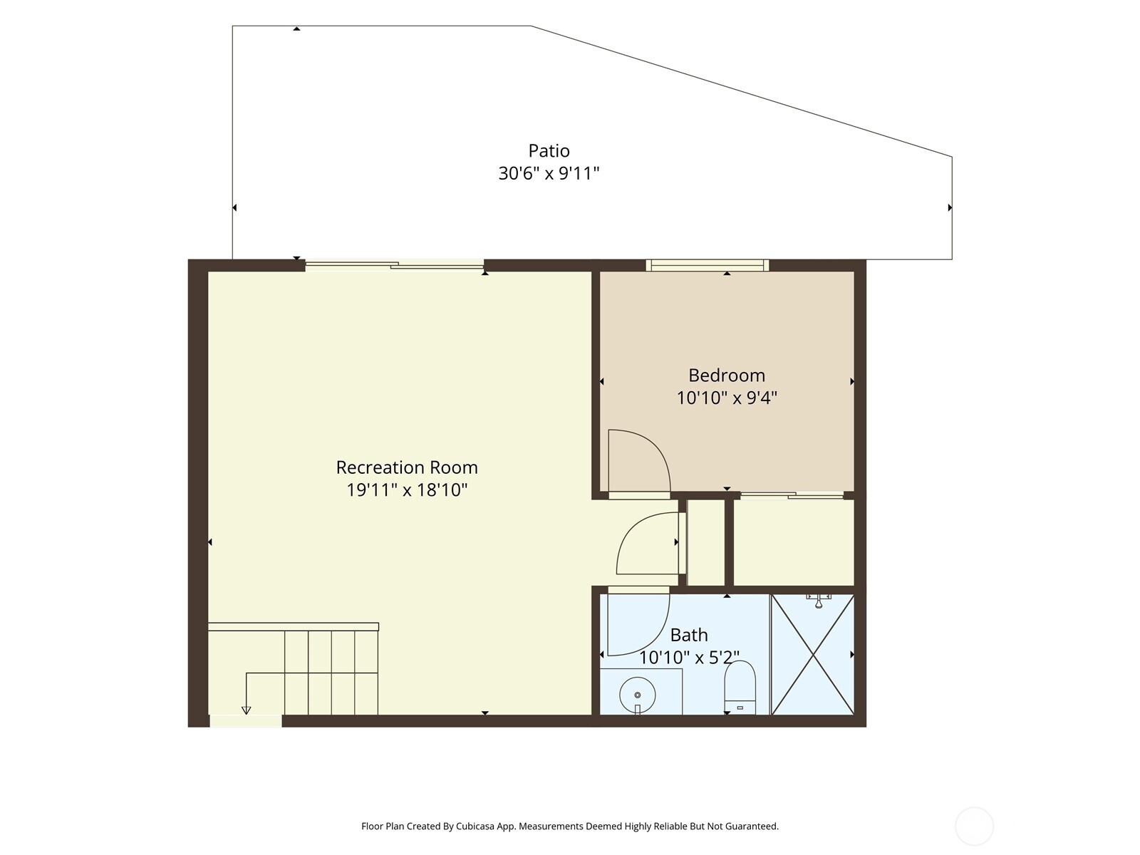 Lower-level floor plan with a large recreation room, bedroom, bathroom, stairs, and patio.