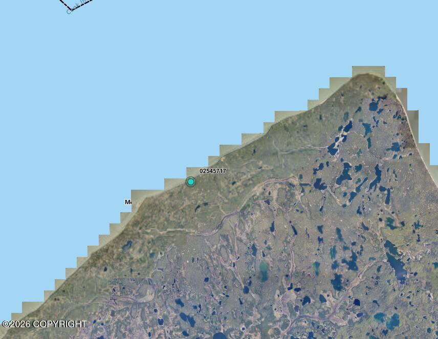 Aerial map of remote Alaskan land marked by a turquoise property pin.