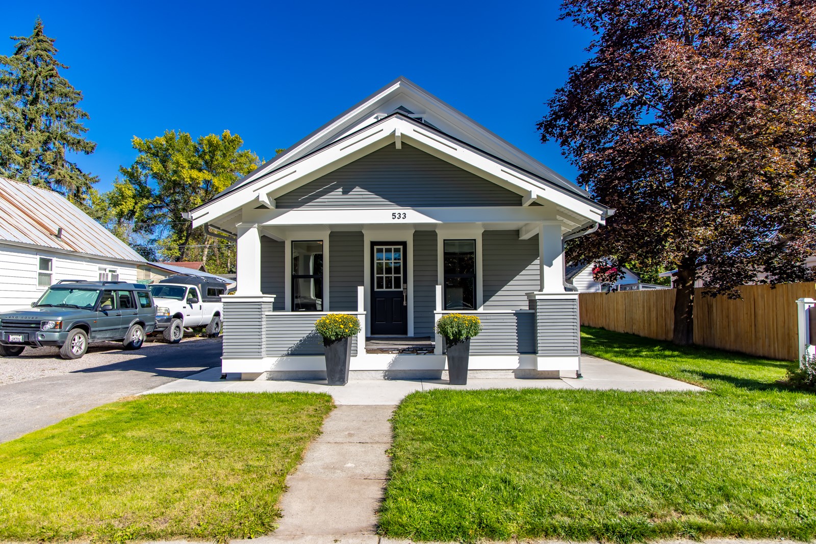Gray bungalow with white trim and a small front porch, marked 533.