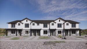 White two-story multi-unit building with front-facing gables and covered entrances, shown in an exterior rendering.