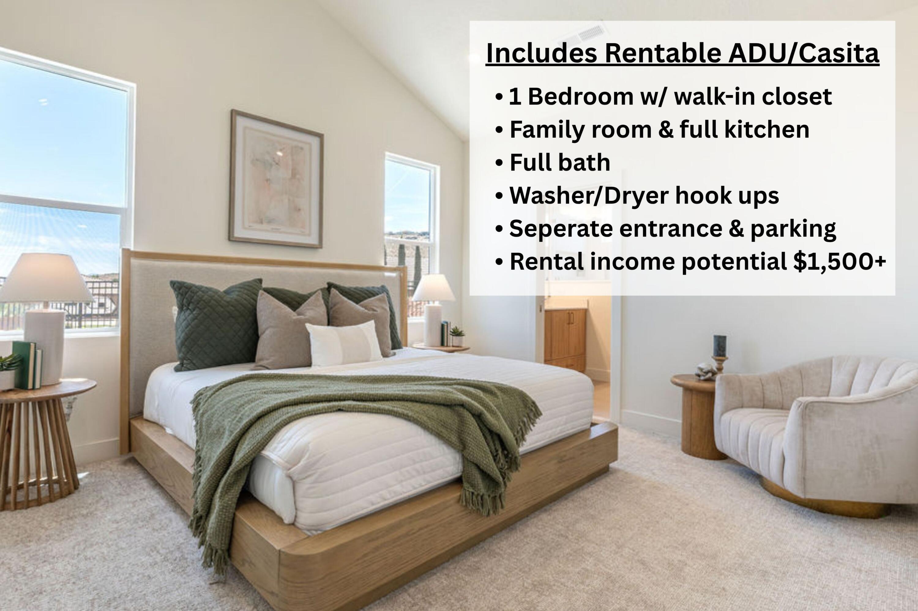 Staged ADU bedroom with a platform bed, large windows, and a separate sitting area.