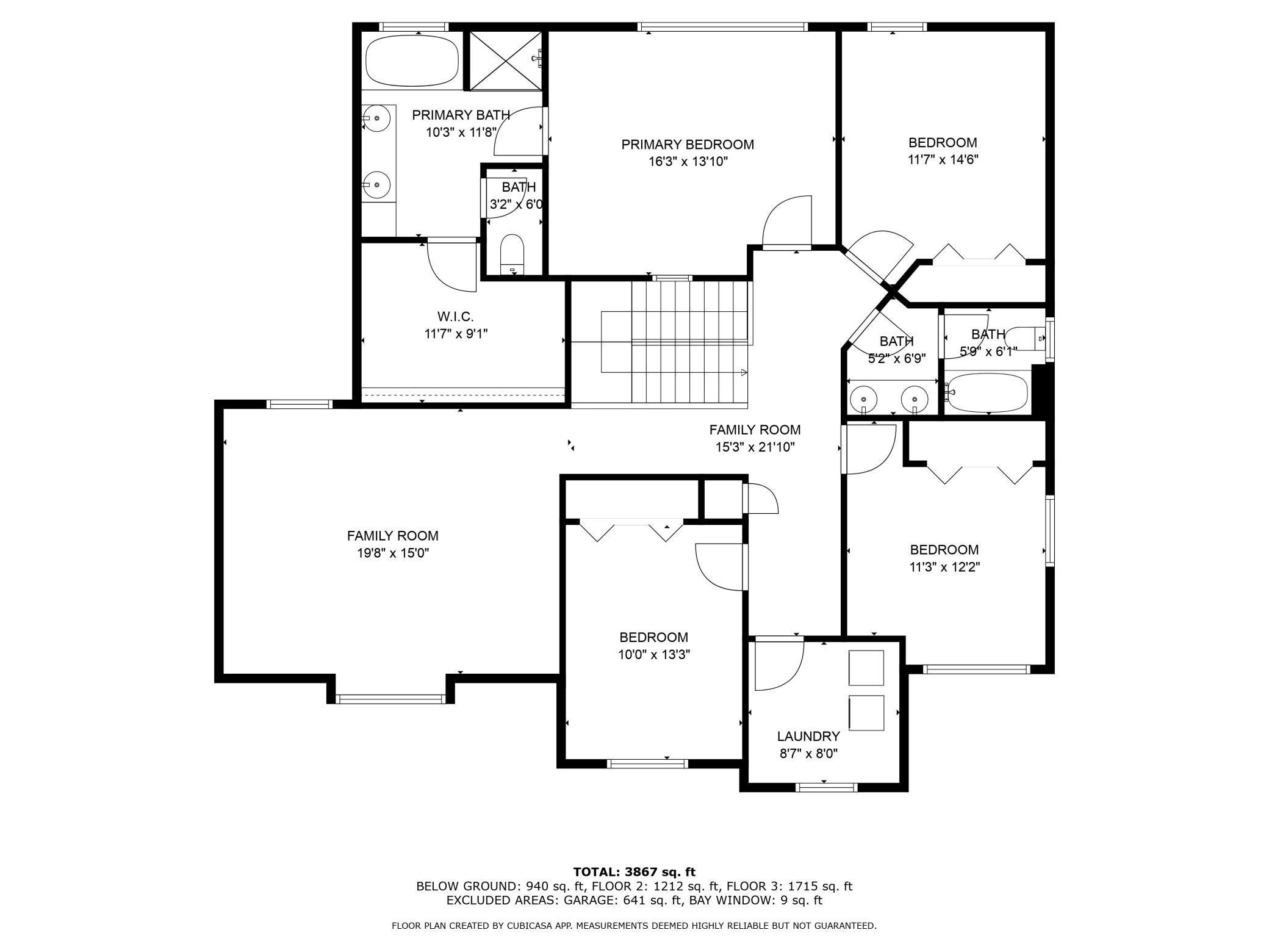 Floor plan with four bedrooms, three bathrooms, two family rooms, and laundry.